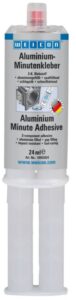 Aluminium Minute Adhesive is an odourless, two-component epoxy adhesive filled with aluminium. It cures fast at room temperature and practically without shrinkage. After curing, the adhesive can be machined (filing, drilling, milling). Aluminium Minute Adhesive is gap-filling and non-dripping (thixotropic) and shows very high tensile, impact and peel strength. The adhesive is particularly suitable for bonding aluminium and other light metals. It can be used for filling cracks and holes on aluminium housings, for example, and for repairing light alloy wheels. In order to achieve optimal adhesion, the bonding surfaces should be dry and free from grease or dirt. Scraping or sanding the surfaces before cleaning additionally improves adhesion.